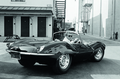 11. Steve McQueen in black jaguar at studio