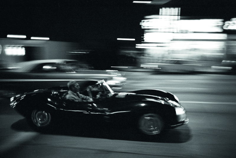 8. Steve McQueen driving his Jaguar XK-SS on Sunset Blvd.